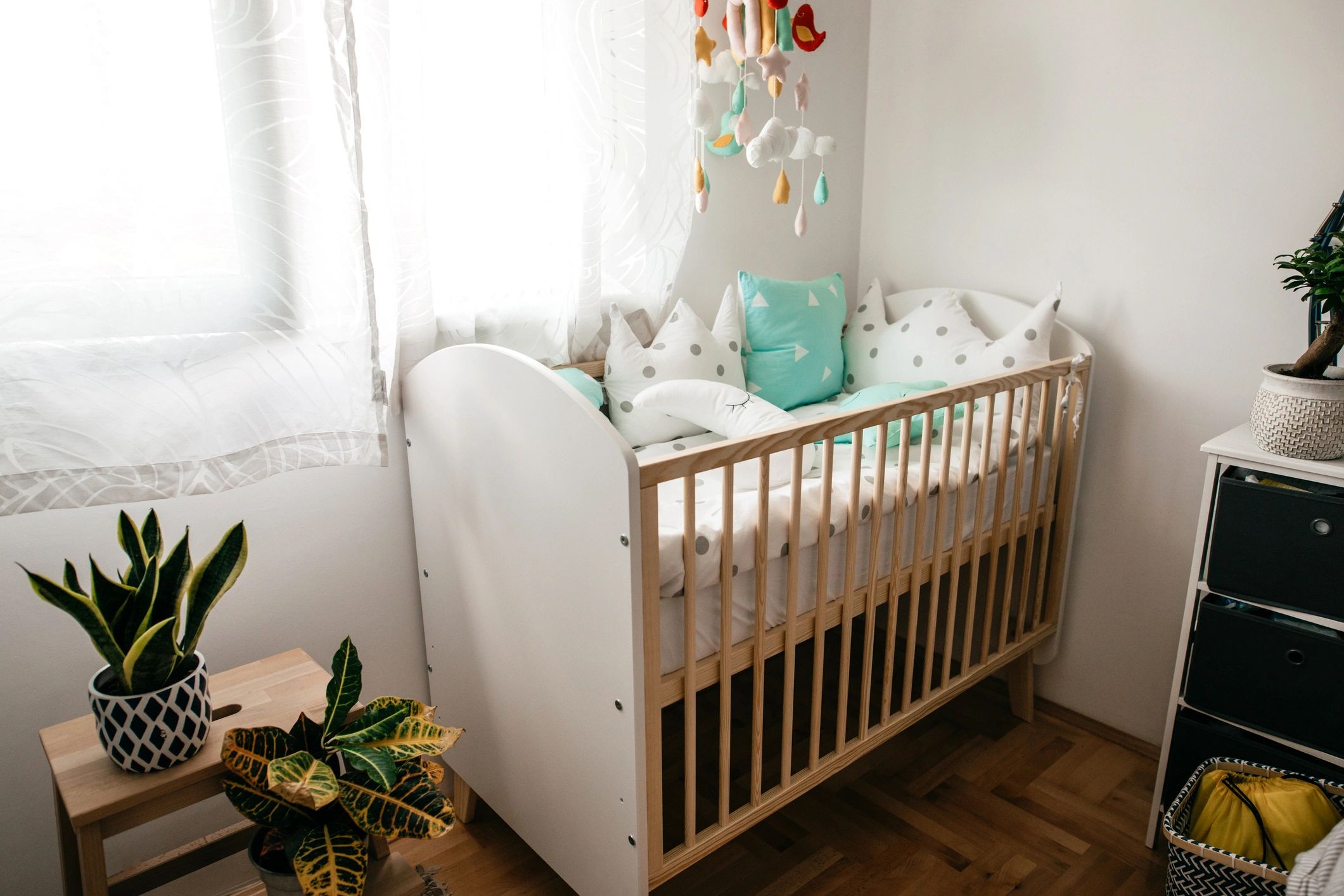 Empty crib in a nursery at home