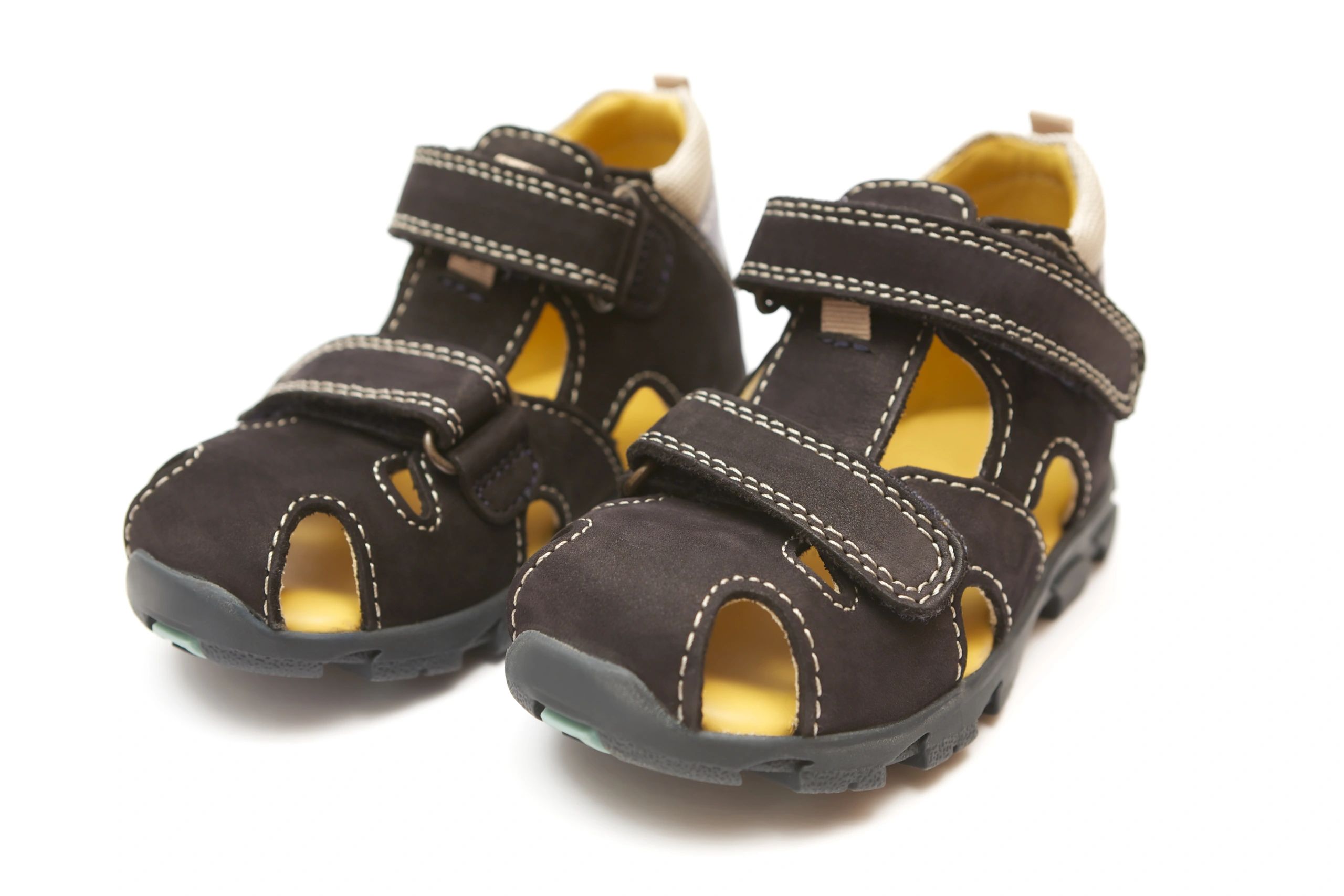 Black children's sandals on a white background