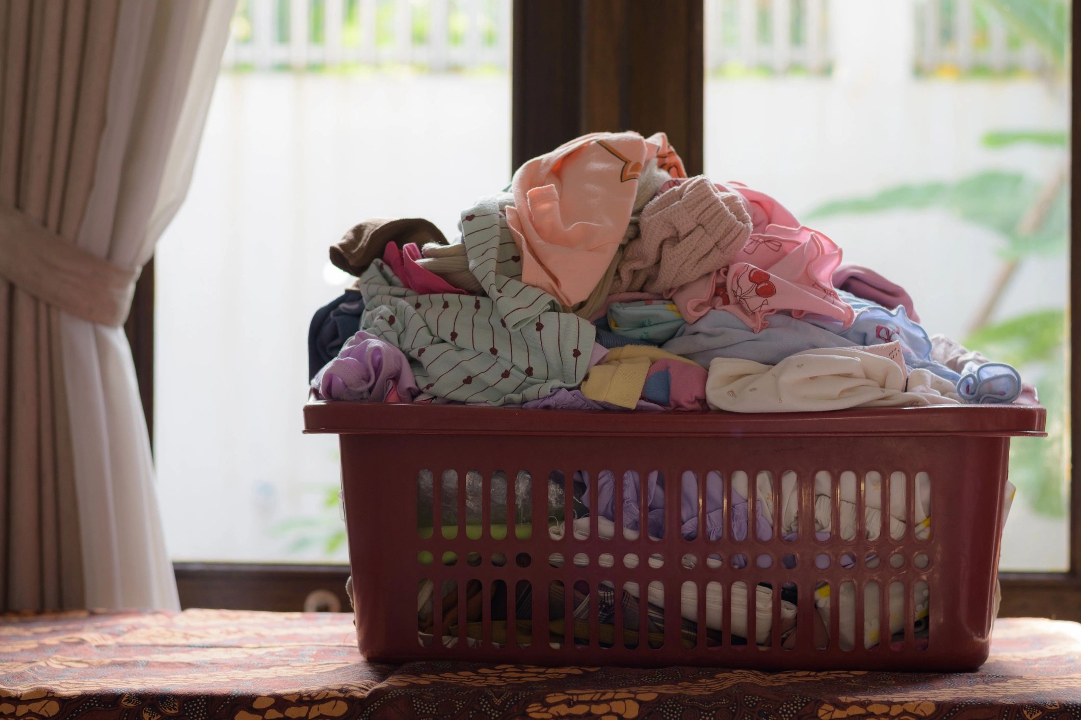 Colorful baby clothes neatly arranged for a kids retail store