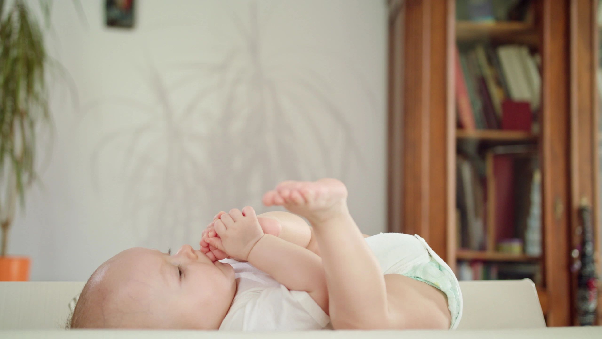 Baby's feet in mother's hands