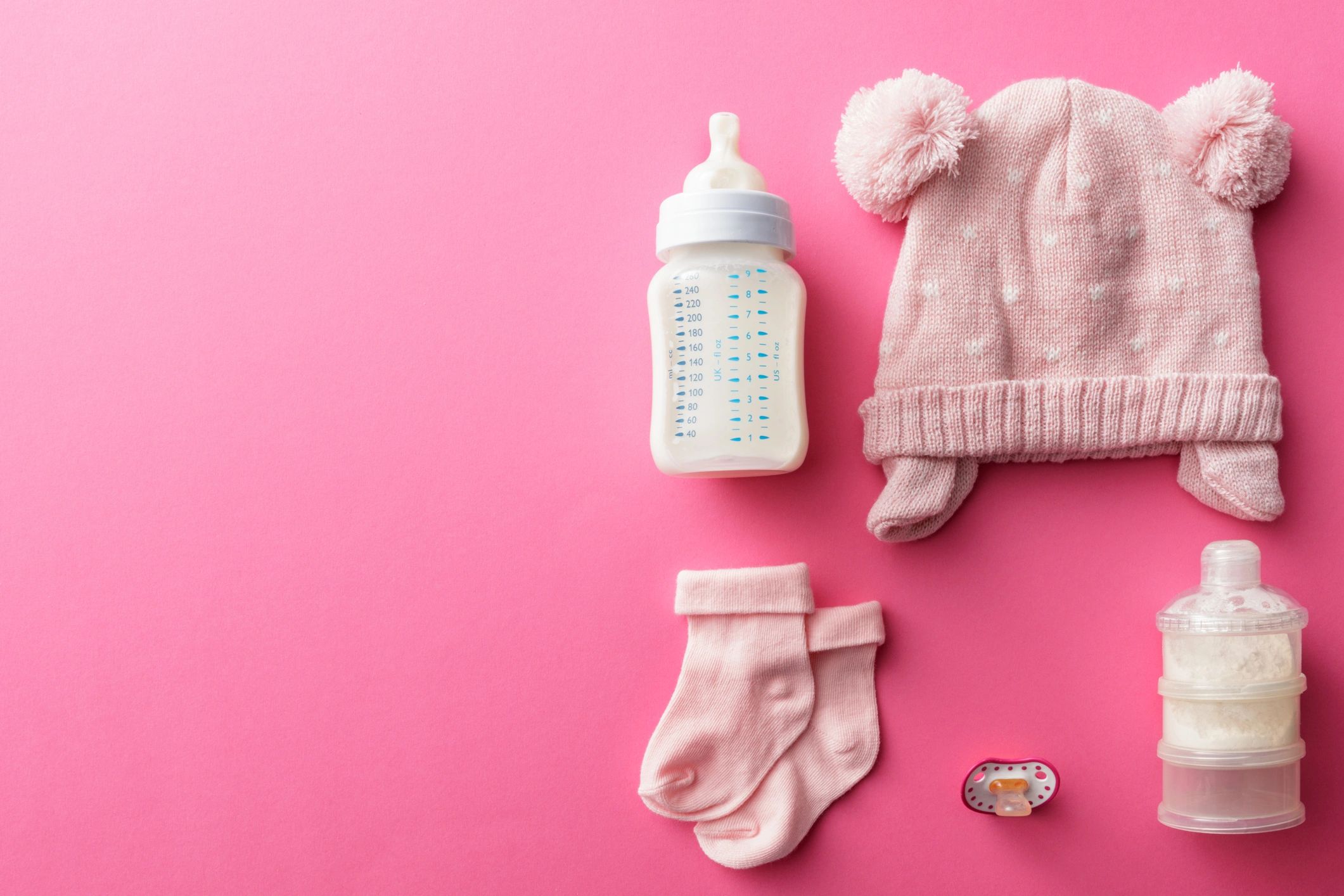 Baby bottle and feeding essentials still life